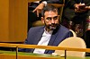A suited delegate sits alone in the Iran section of the UN General Assembly.
