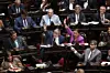 Legisladores reunidos en el recinto de la Cámara de Diputados mientras varios intervienen en el debate.